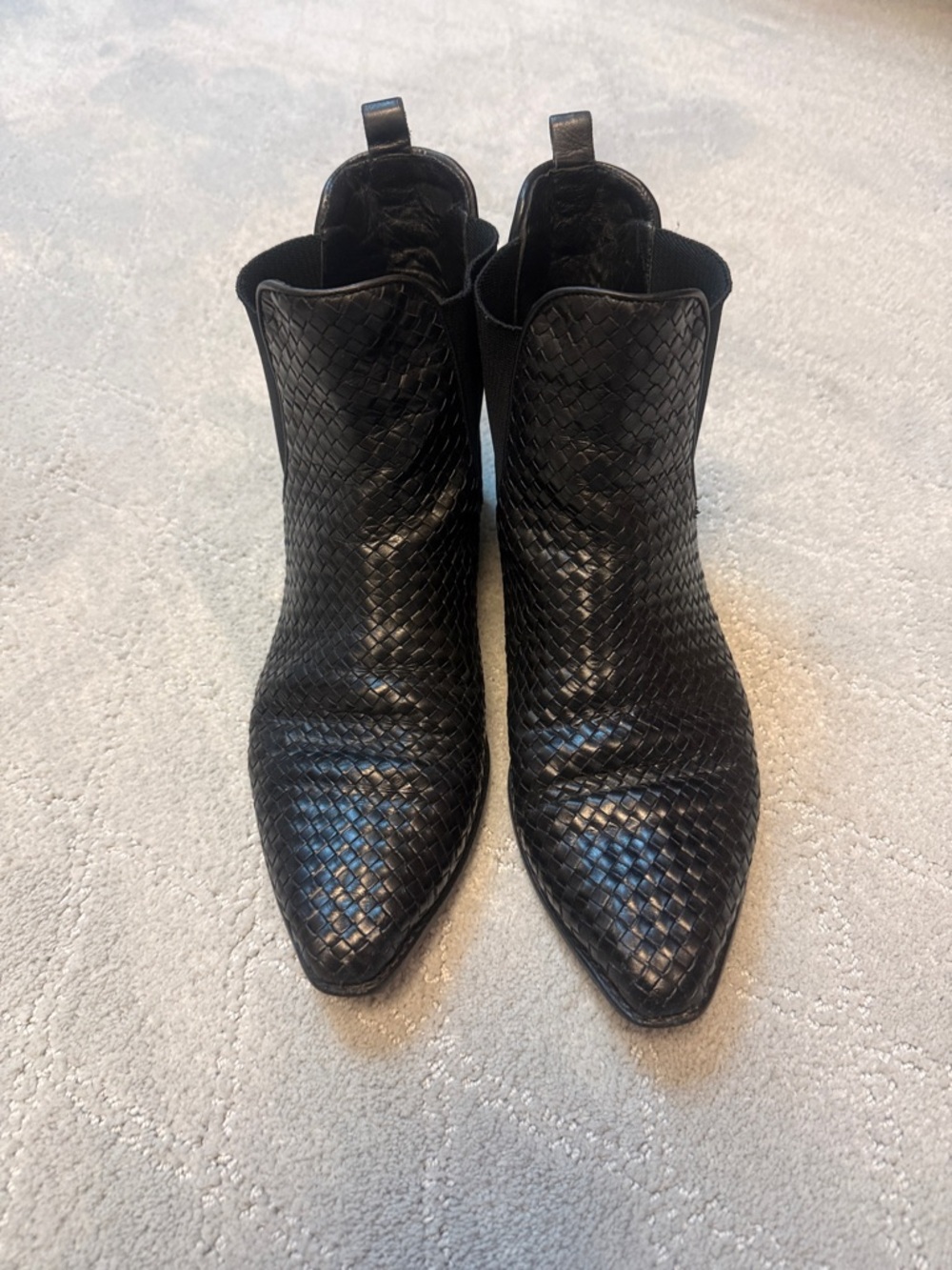 Black leather ankle boots and wallet belt.